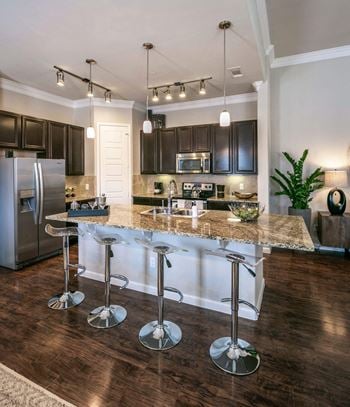 Designer kitchen cabinets with modern stainless steel whirlpool® appliances